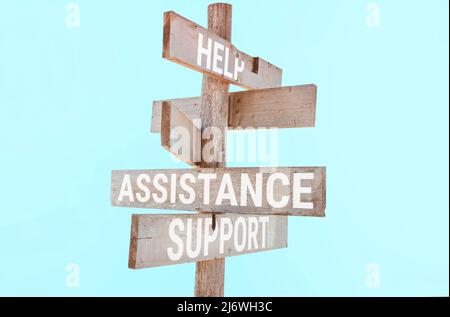 Cartello stradale in legno con parole aiuto, supporto, assistenza Foto Stock