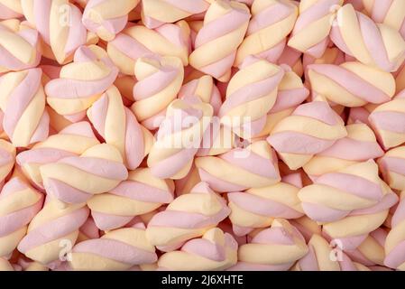 Marshmallow rosa e bianco in primo piano. Dolce sfondo caramella Foto stock  - Alamy