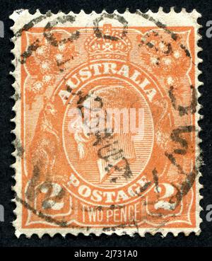 Un francobollo arancione del 2D "Two Pence" King George V Australian. Foto Stock