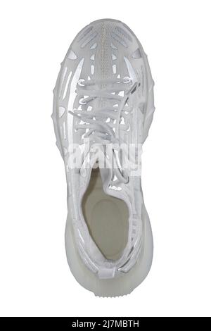 Scarpe sportive. Sneaker in tessuto bianco con strisce riflettenti grigie. Foto Stock