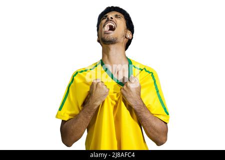 Atleta maschile o fan in uniforme gialla che celebra isolato Foto Stock