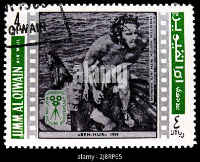 MOSCA, RUSSIA - 14 MAGGIO 2022: Francobollo stampato in Umm al-Qiwain mostra Charlton Heston, Jack Hawkins, screen actor serie, circa 1969 Foto Stock