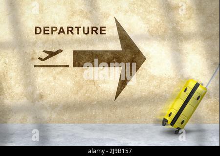 Cartello per l'aeroporto con l'icona dell'aeroplano Partenze sul muro. Passeggero che arrotola il bagaglio in movimento. Concetto di viaggio, giovani viaggiatori a piedi con Suitcase e F. Foto Stock