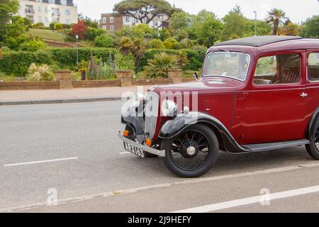 1930s Maroon d'epoca Austin Seven New Ruby in Exmouth Devon UK anche conosciuto come il Baby Austin Foto Stock