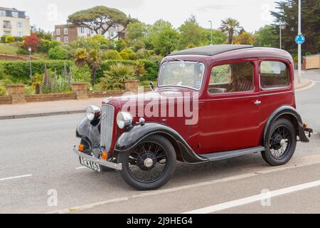 1930s Maroon d'epoca Austin Seven New Ruby in Exmouth Devon UK anche conosciuto come il Baby Austin Foto Stock
