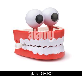 Divertente orologio giocattolo saltando i denti con gli occhi isolati su bianco Foto Stock