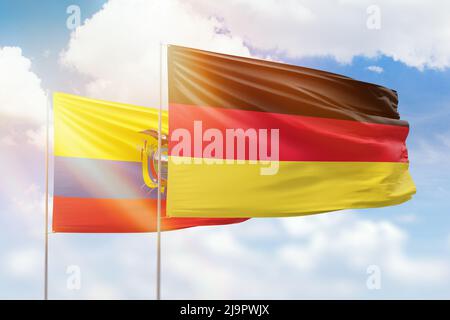 Cielo azzurro soleggiato e bandiere di germania e ecuador Foto Stock