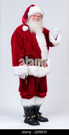 Ritratto a tutta lunghezza di Babbo Natale che sventolava. Foto Stock