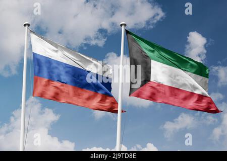 Russia e Kuwait due bandiere su flagpoli e sfondo blu cielo nuvoloso Foto Stock