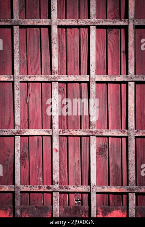 Sfondo o struttura graticcio di ferro su una porta di legno Foto Stock