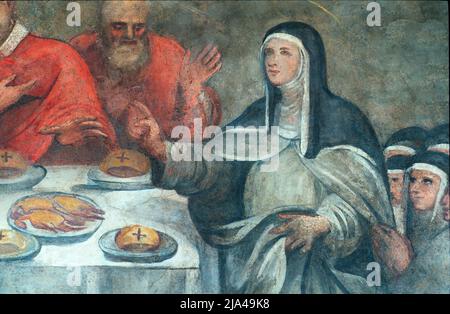 Chiara d'Assisi benedice il pane per volere del Papa, affresco nel monastero di San Damiano, Assisi, Italia Foto Stock