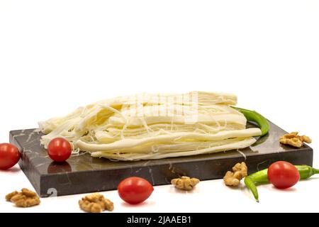 Formaggio a cordoncino. Delizioso formaggio a base di latte fresco di vacca. Nome locale tel peyniri. Primo piano Foto Stock