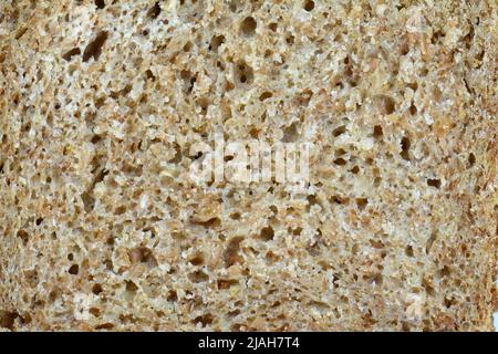 sfondo marrone texture pane. Consistenza di pane marrone cotto con farina di segale Foto Stock