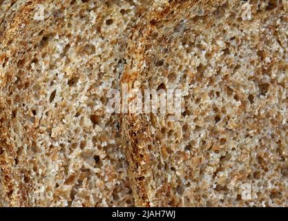 sfondo marrone texture pane. Consistenza di pane marrone cotto con farina di segale Foto Stock