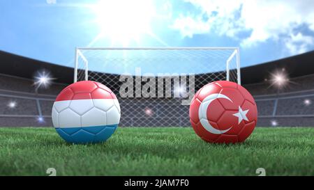 Due palline da calcio nei colori delle bandiere sullo sfondo sfocato dello stadio. Lussemburgo e Turchia. immagine 3d Foto Stock