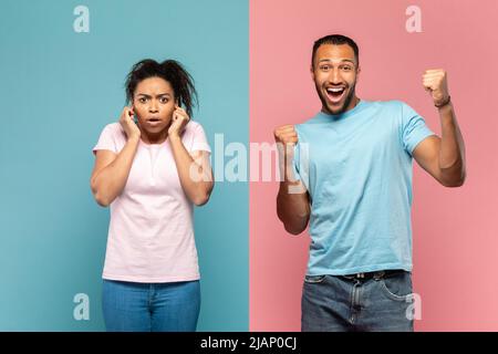 Felice giovane uomo nero urlando forte, celebrando la vittoria, spaventato donna chiudendo le orecchie con le dita, scioccato di rumore Foto Stock