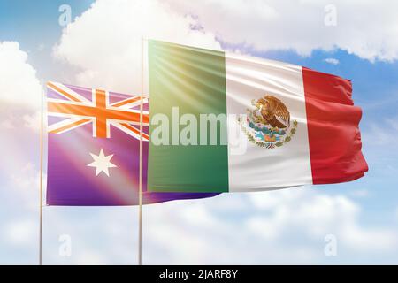 Cielo azzurro soleggiato e bandiere di messico e australia Foto Stock