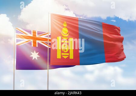 Cielo azzurro soleggiato e bandiere della mongolia e dell'australia Foto Stock