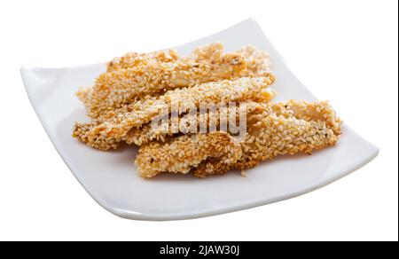 Strisce di pollo al sesamo con salsa Foto Stock