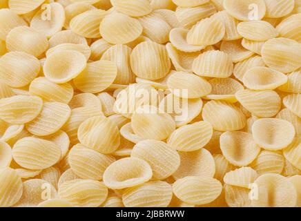 Sfondo di pasta orecchiette non cotte Foto Stock
