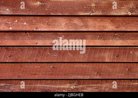 Struttura di tavole di legno rosso, sfondo astratto. Foto Stock