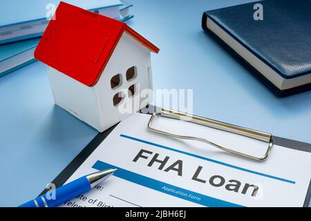 FHA prestito applicazione e modello di casa. Foto Stock