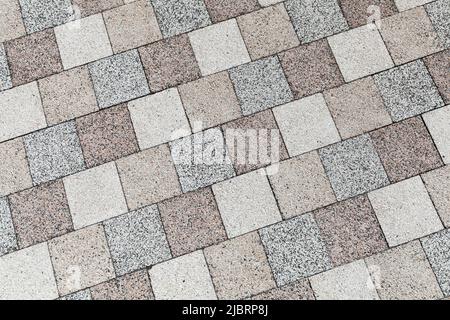 Street pavement sfondo foto texture, quadrato blocchi di pietra colorati Foto Stock