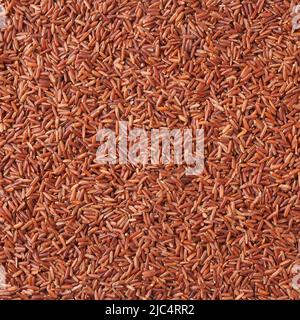Fondo di riso rosso crudo Foto Stock