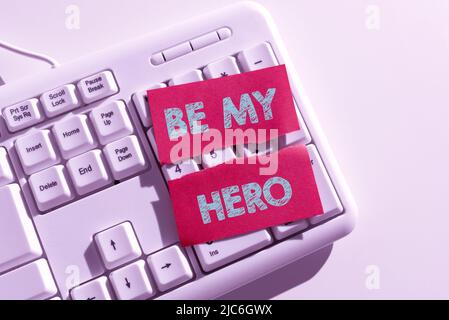 Cartello che mostra Be My Hero. Concetto significato richiesta da qualcuno di ottenere alcuni sforzi di azioni eroiche per lui -47610 Foto Stock