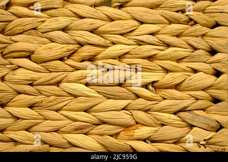 Tradizionale artigianato tessitura di stile tailandese motivo natura sfondo texture superficie vimini per il materiale della mobilia. Foto Stock