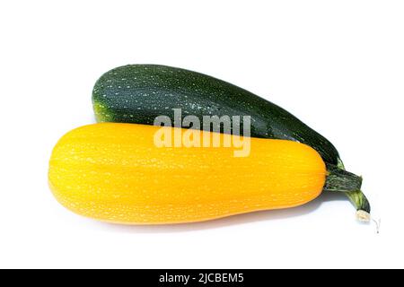 Due zucchine mature su sfondo bianco verde e giallo Foto Stock