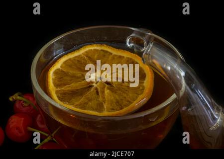 Tazza di tè trasparente con arancia Foto Stock