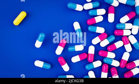 Capsule pillole rosse e blu e un giallo per la medicina e la salute e farmaci con sfondo blu 3D Foto Stock