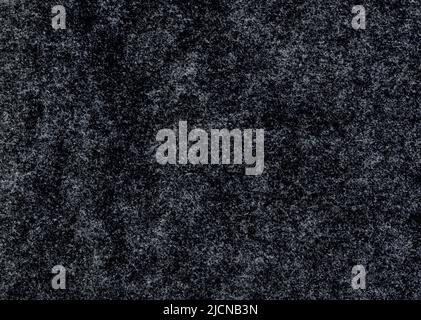 Alto dettaglio ingrandito primo piano grande immagine di carta ruvida grigio nero non patinata texture sfondo scansione grunge carta da parati pronunciata fibra grana e parte Foto Stock