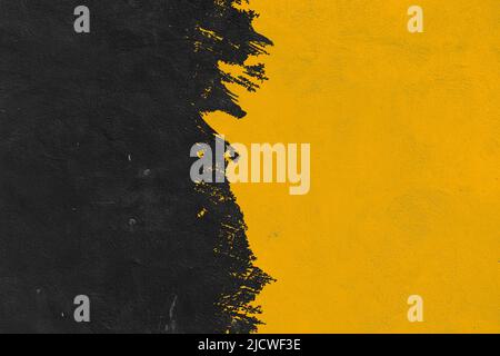 Nero e giallo pennello texture background.Abstract brushstroke background, forme piatte .su un muro di cemento Foto Stock