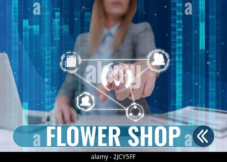 Cartello con la scritta Flower Shop. Parola per dove i fiori recisi sono venduti con le decorazioni per i regali Lady in suit puntando dito rappresenta globale innovativo Foto Stock