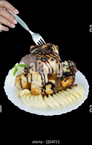 Die taglio di pane miele toast e gelato zucchero di sudore su nero isolato. Foto Stock