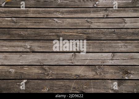 Vecchie tavole di legno di un molo in orientamento orizzontale Foto Stock