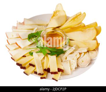 Piatto di formaggi con pere e miele Foto Stock