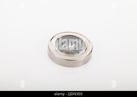 Bussola su sfondo neutro. Foto Stock