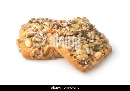 Biscotti con noci e semi isolati su bianco Foto Stock