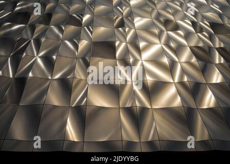 Design scultoreo contemporaneo, edificio rivestito in pannelli metallici formati nel 3D. I pannelli perforati nascondono le finestre. Architettura moderna. Foto Stock