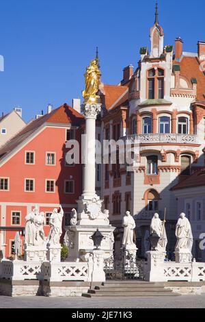 Slovenia, Maribor, Piazza principale, Monumento della peste, Hotel Maribor, Foto Stock