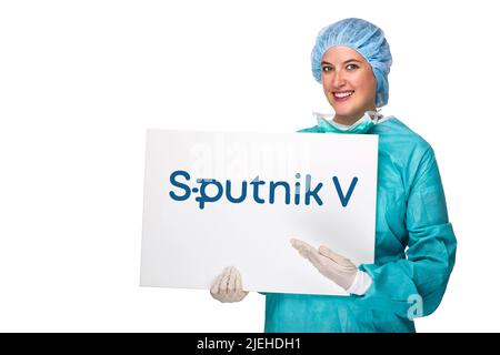 Arzt, Ärztin, OP-Schwester, Maske, Schutzmaske, Corona, Covid-10, Maskenpflicht, FFP-2-Maske, Medizinische Maske, Schild, Tafel, Werbung, Sputnik V, Foto Stock