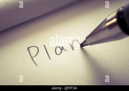 Immagine ravvicinata della scrittura DI un piano di parole su un foglio per notebook. Foto Stock