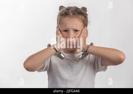 Giovane donna Escape artista - ragazza con manette - un bambino in difficoltà Foto Stock