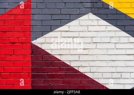 Frammento colorato di muro di mattoni dipinti. Sfondo creativo astratto Foto Stock