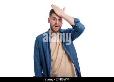 Giovane uomo che si sente scioccato Foto Stock
