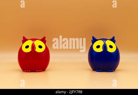 Giocattoli di Owl in plastica rosso e blu isolati su sfondo arancione. Foto Stock