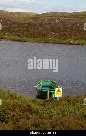 Barca a remi a Loch Druidibeag, South Uist, Ebridi esterne Foto Stock